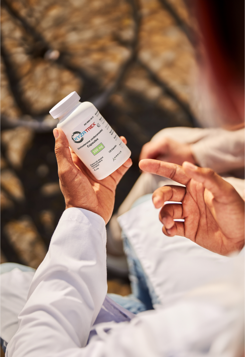 Man Viewing KYZATREX Bottle